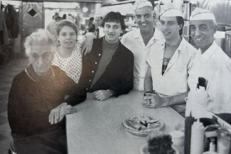 Stratty is the dude next to the dude in the black shirt. 